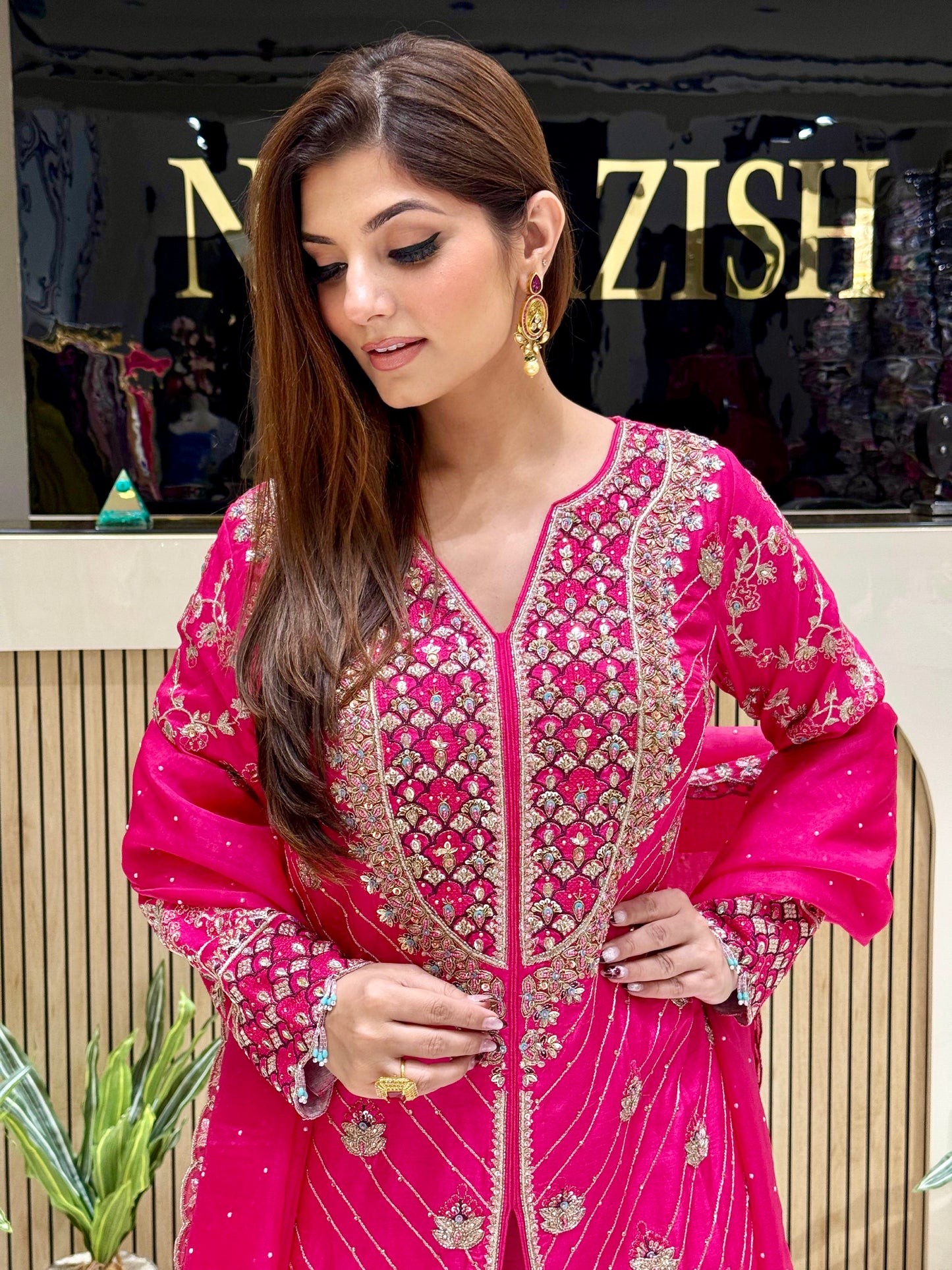 Luxury hot pink Sharara suit in raw silk with hand embroidery, ideal for bridal functions and festive occasions.