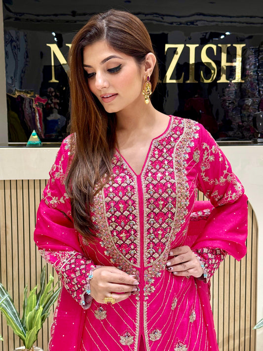 Luxury hot pink Sharara suit in raw silk with hand embroidery, ideal for bridal functions and festive occasions.