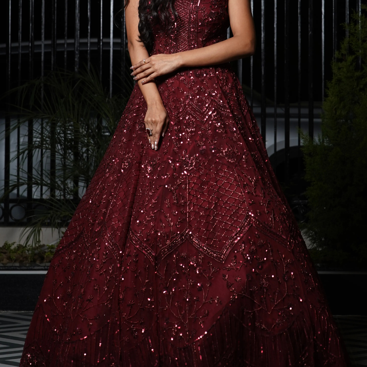 Celebrate your big day in this deep maroon bridal gown, hand-embellished by skilled artisans for a look that’s rich, refined, and unforgettable. With intricate embroidery and a flattering fit, this designer piece is made for the modern Indian bride who values heritage and high fashion.