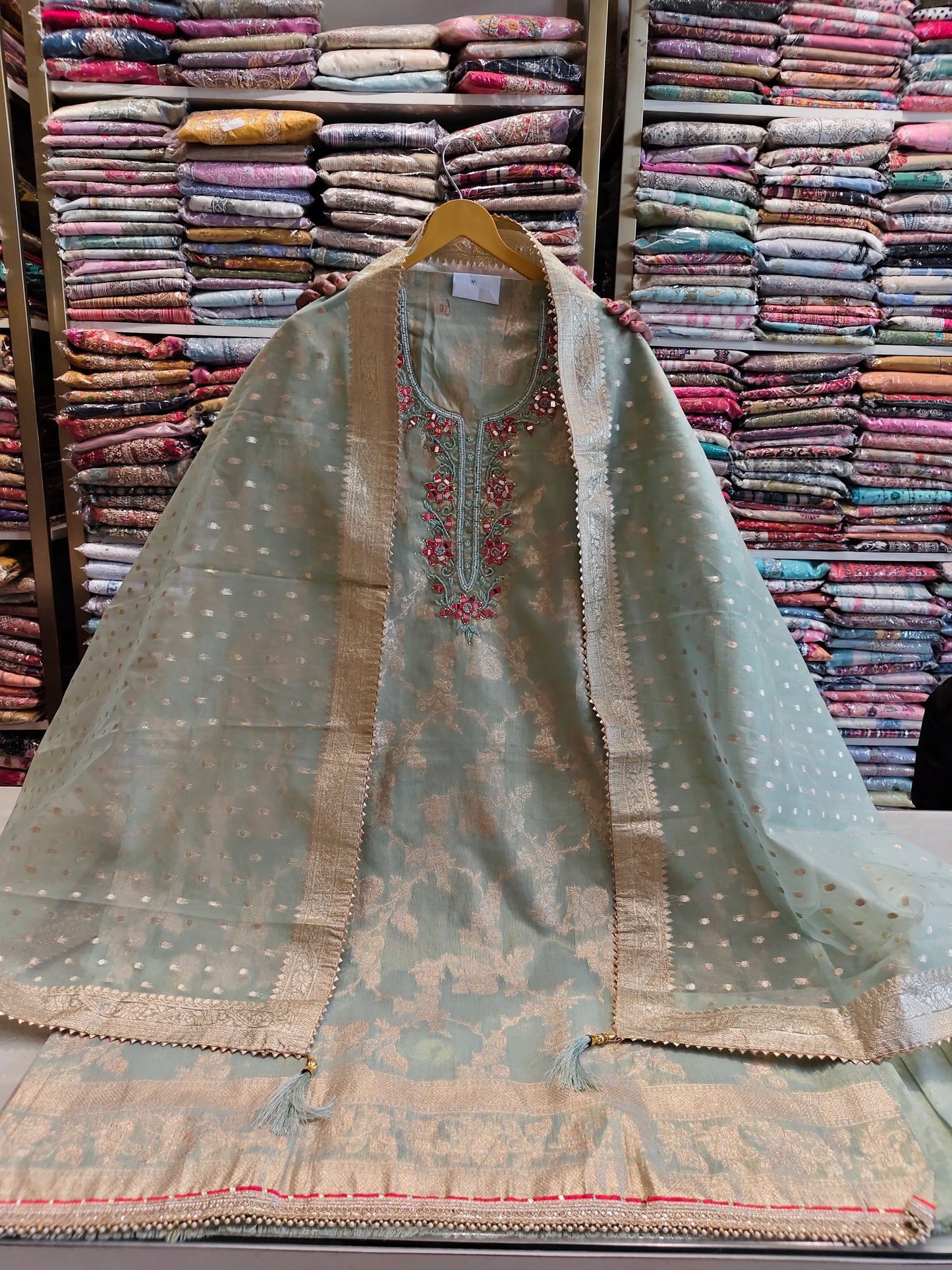 Green tissue mirror work suit
Kutdana zari festive suit
Organza dupatta ethnic wear
Designer unstitched party suit
Traditional green suit for women