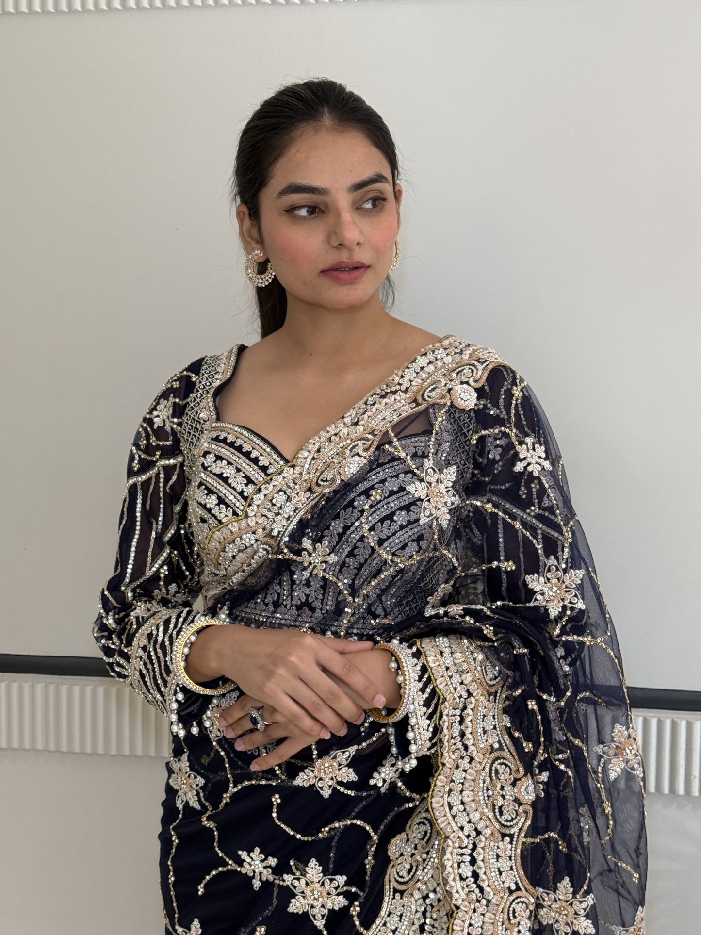 Midnight Elegance: Hand-Embellished Blue Sari with Stitched Blouse