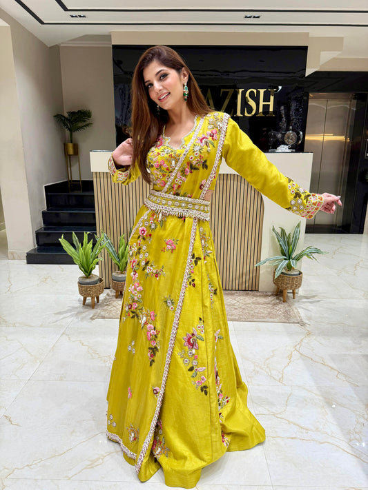 Neon raw silk lehenga set featuring a full-sleeve hand embellished crop top, matching skirt, and one-shoulder draped dupatta with a heavy embellished belt.