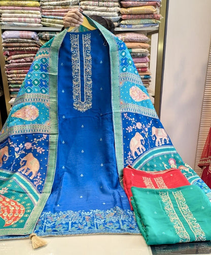Premium Dola Silk suit with elegant Dabka work and zari dupatta
• Designer unstitched festive wear with Upara Silk bottom for women
• Luxury Dola Silk dress material perfect for weddings and party wear
• Stylish ethnic suit with heavy Dabka work and Mudaal Silk dupatta
• Party wear Dola Silk suit with rich festive and traditional royal look
