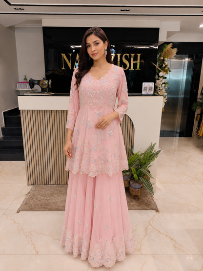 Baby Pink Sharara Set
Indo Western Festive Wear
Designer Peplum Outfit India
Resham Work Party Wear
Fusion Wedding Wear Women