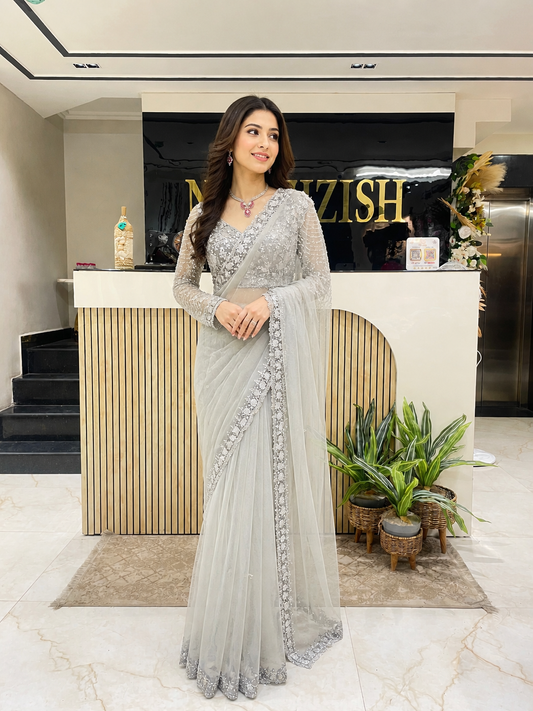 Grey net saree with sequins work
Designer zarkan katdana saree
Party wear net saree grey
Ready-made blouse saree set
Elegant embroidered net saree