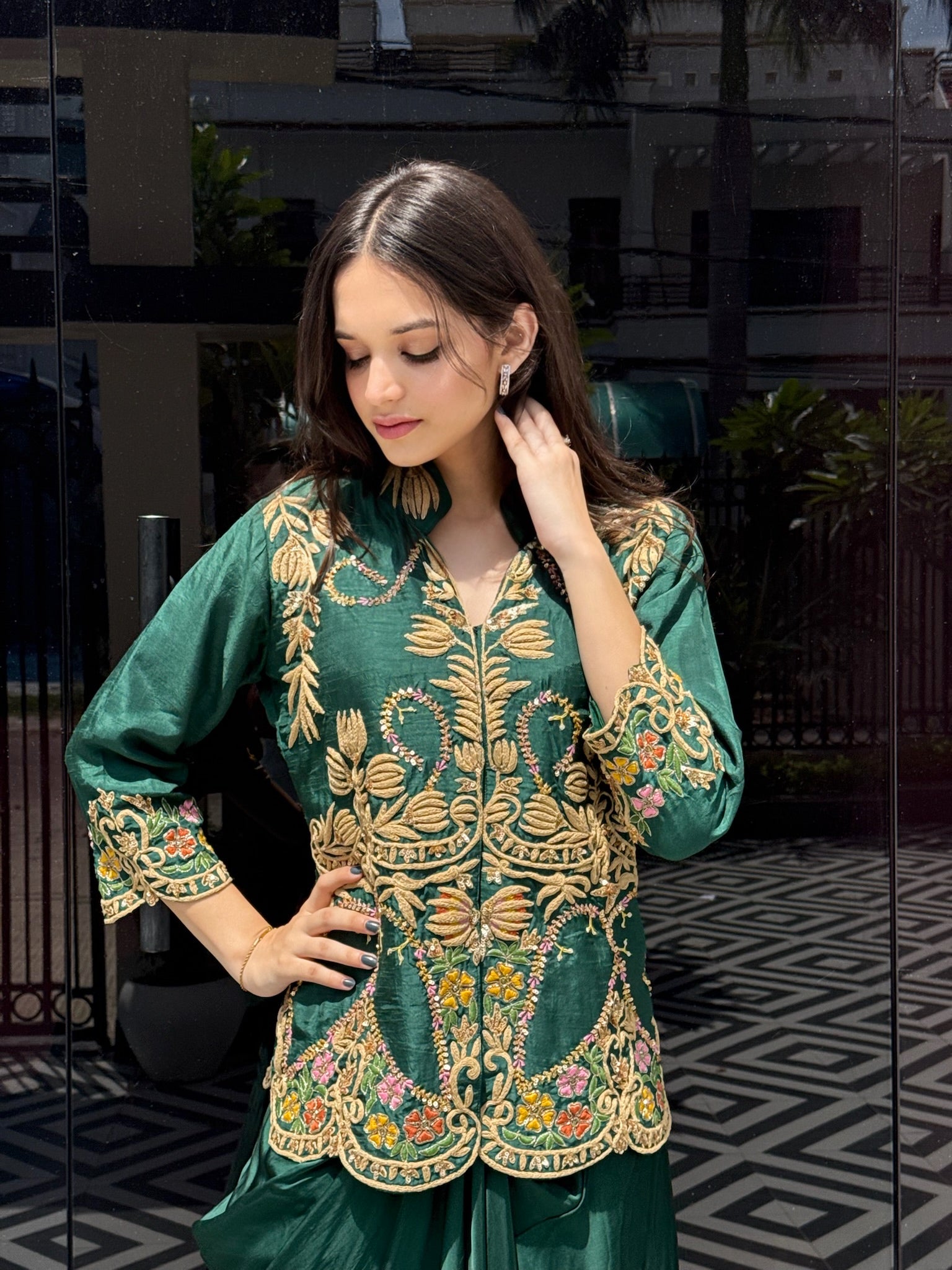 A perfect balance of luxury and ease—this emerald co-ord set highlights a finely hand-worked shirt and a graceful crêpe draped skirt for a polished Western look.
