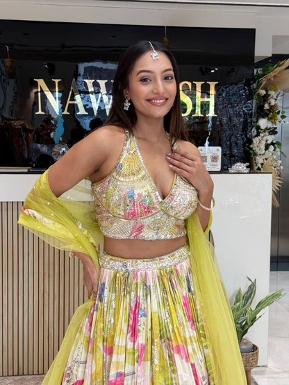 A contemporary floral lehenga with cape-style dupatta, blending modern silhouettes with traditional craftsmanship—ideal for wedding guests and bridesmaids.