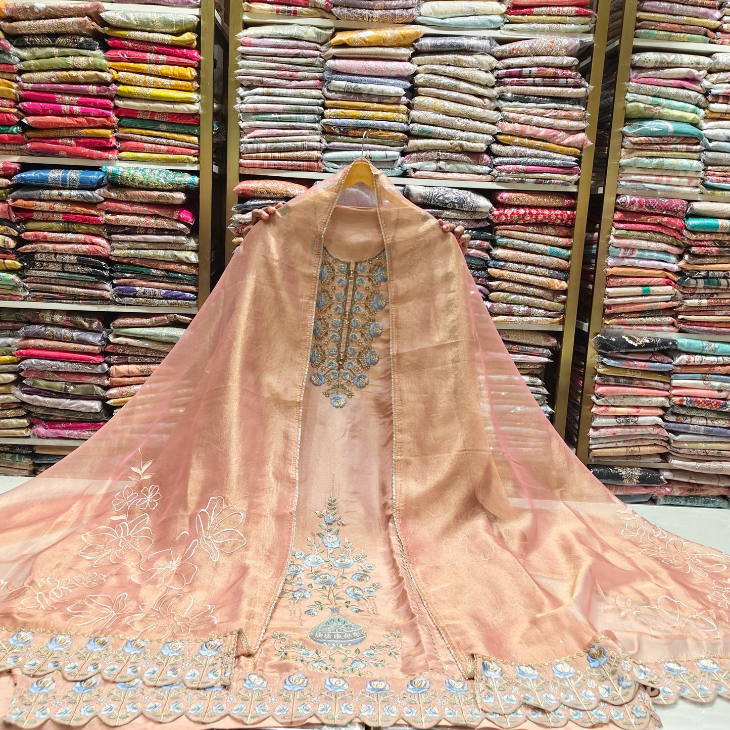 Peach Tissue Suit Set
Zari Katdana Work Dress Material
Designer Unstitched Suit India
Festive Wear Peach Suit
Elegant Ethnic Suit Set