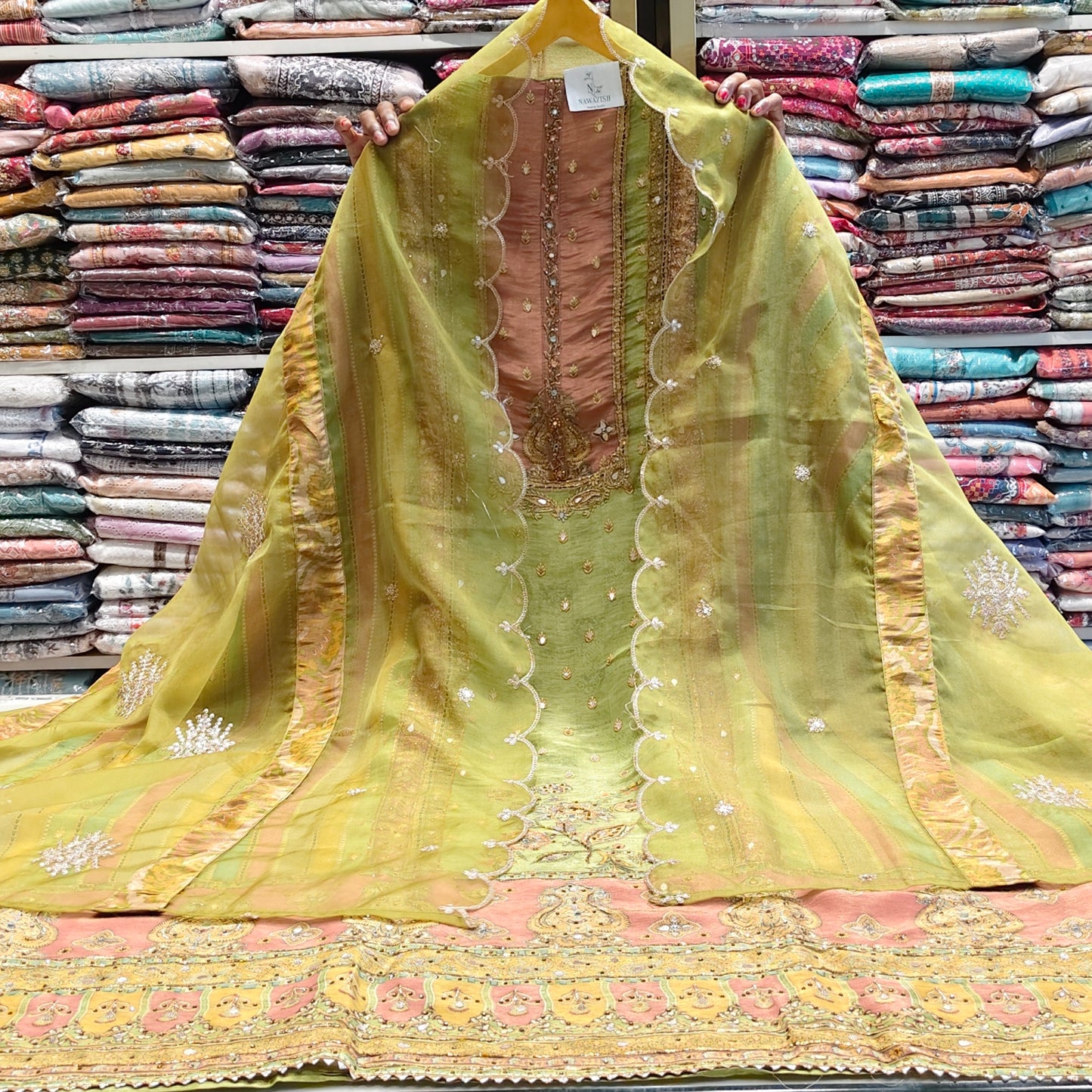 Mehndi green tissue suit
Gota patti digital print suit
Organza dupatta zari sequins suit
Festive unstitched suit set
Designer ethnic wear mehndi suit