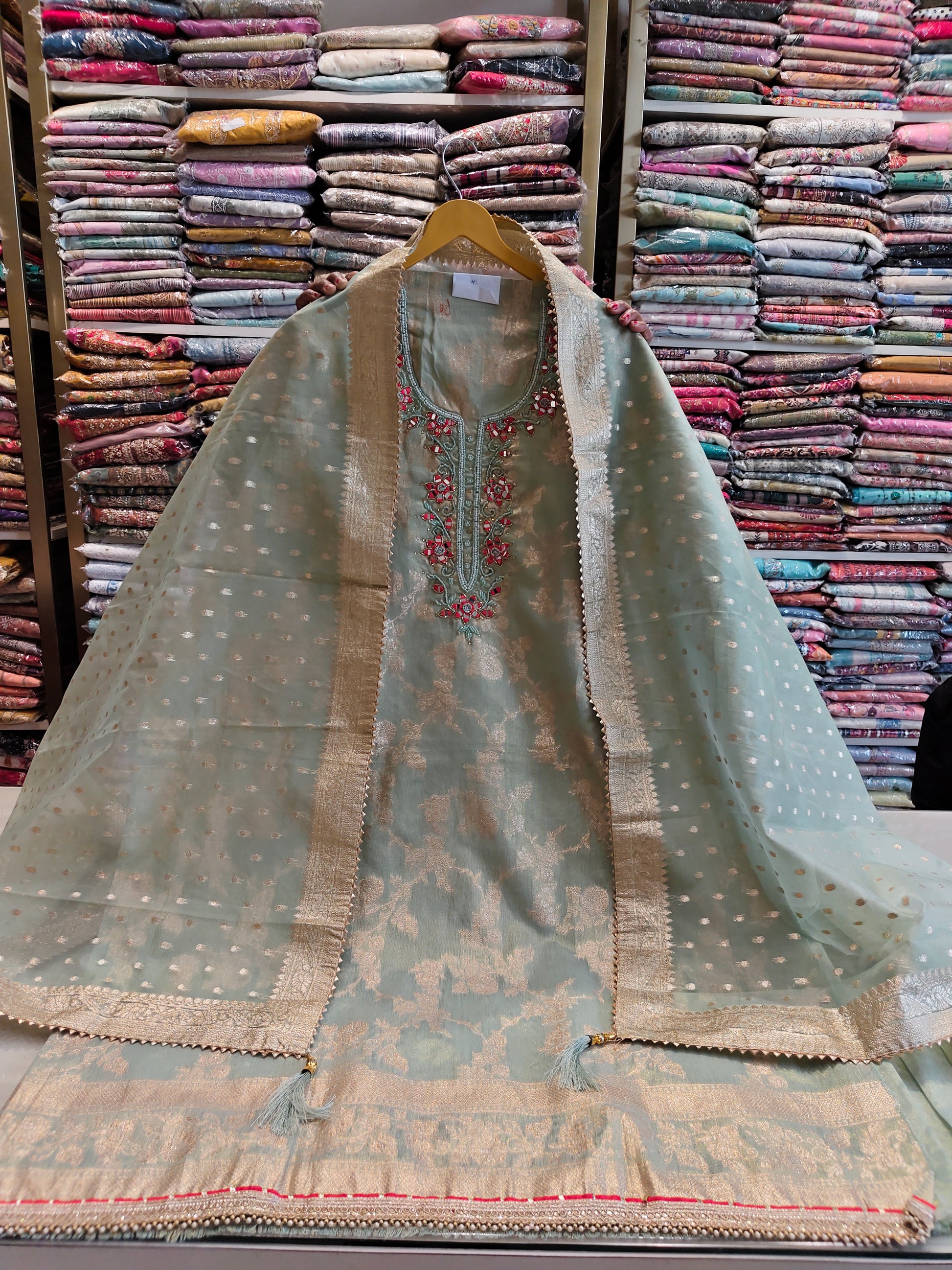 Green tissue mirror work suit
Kutdana zari festive suit
Organza dupatta ethnic wear
Designer unstitched party suit
Traditional green suit for women