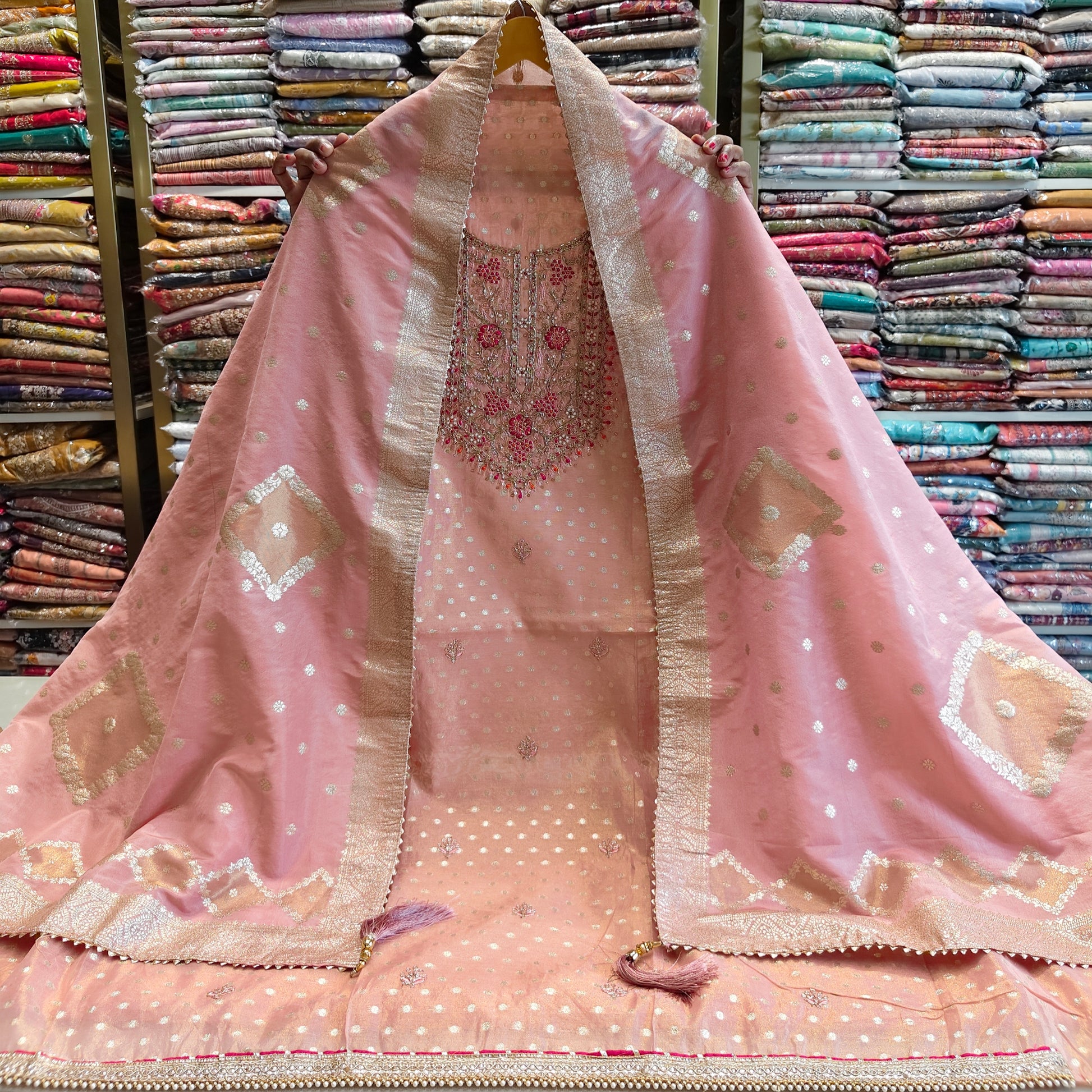 Rose gold tissue suit
Dabka kutdana work suit
Designer festive ethnic wear
Chiffon dupatta zari suit
Party wear unstitched suit set