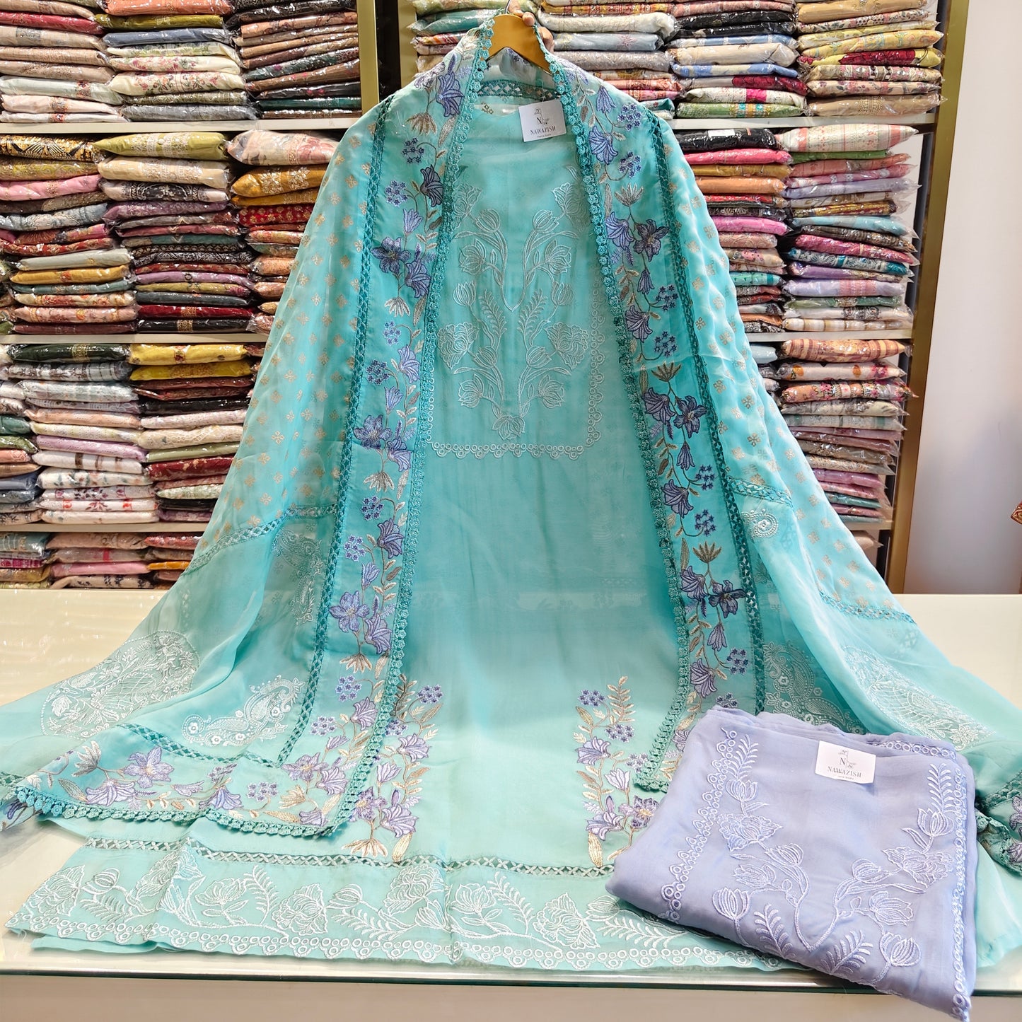 Organza Thread Work Suit Set
Unstitched Organza Dress Material
Festive Ethnic Wear for Women
Thread Work Dupatta Suit
Elegant Indian Suit Set