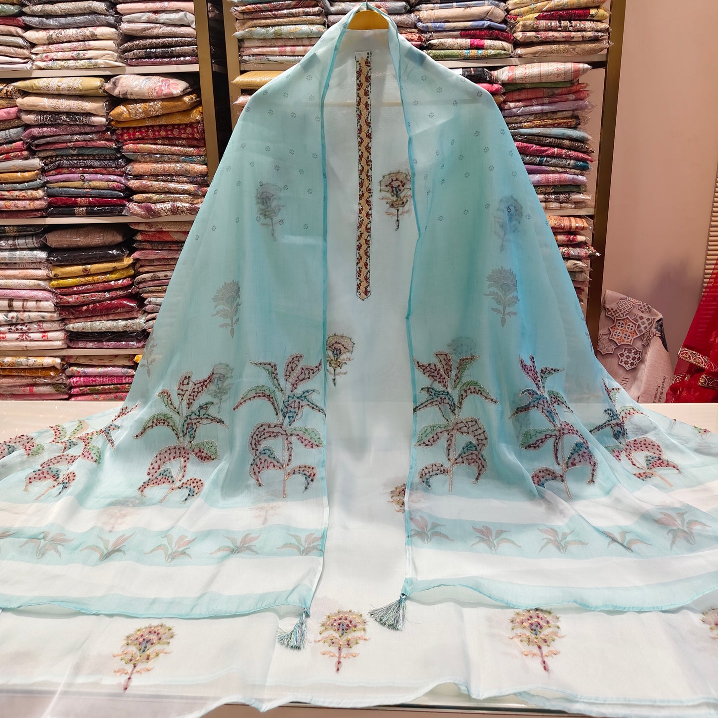 Ice Blue Organza Suit Set
Thread Work Dress Material
Sequins Organza Ethnic Wear
Festive Unstitched Suit Set
Elegant Organza Dupatta Suit