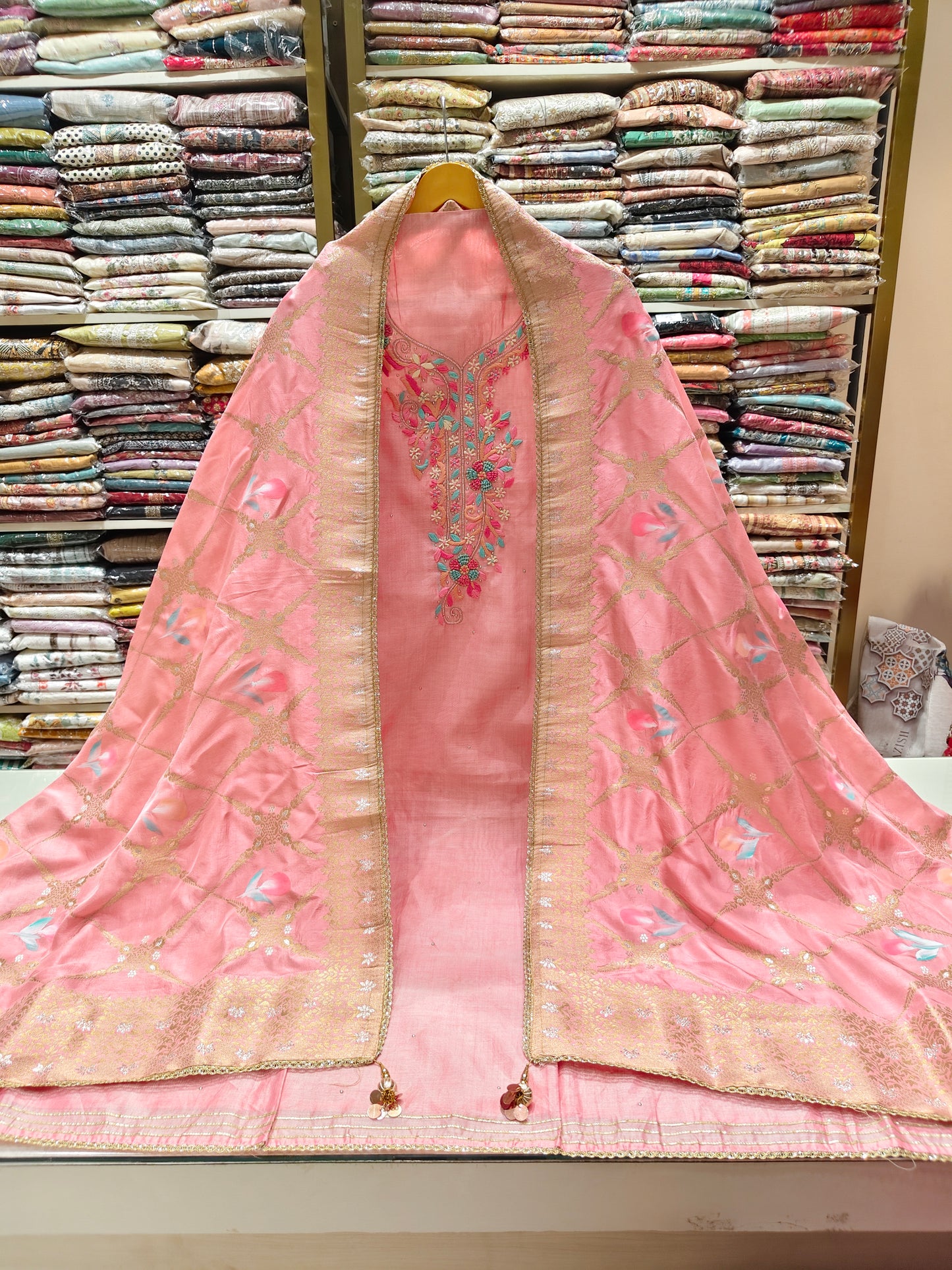 Pink silk suit set
Unstitched ethnic wear
Resham & sequins work suit
Hand printed zari dupatta
Luxury festive silk outfit