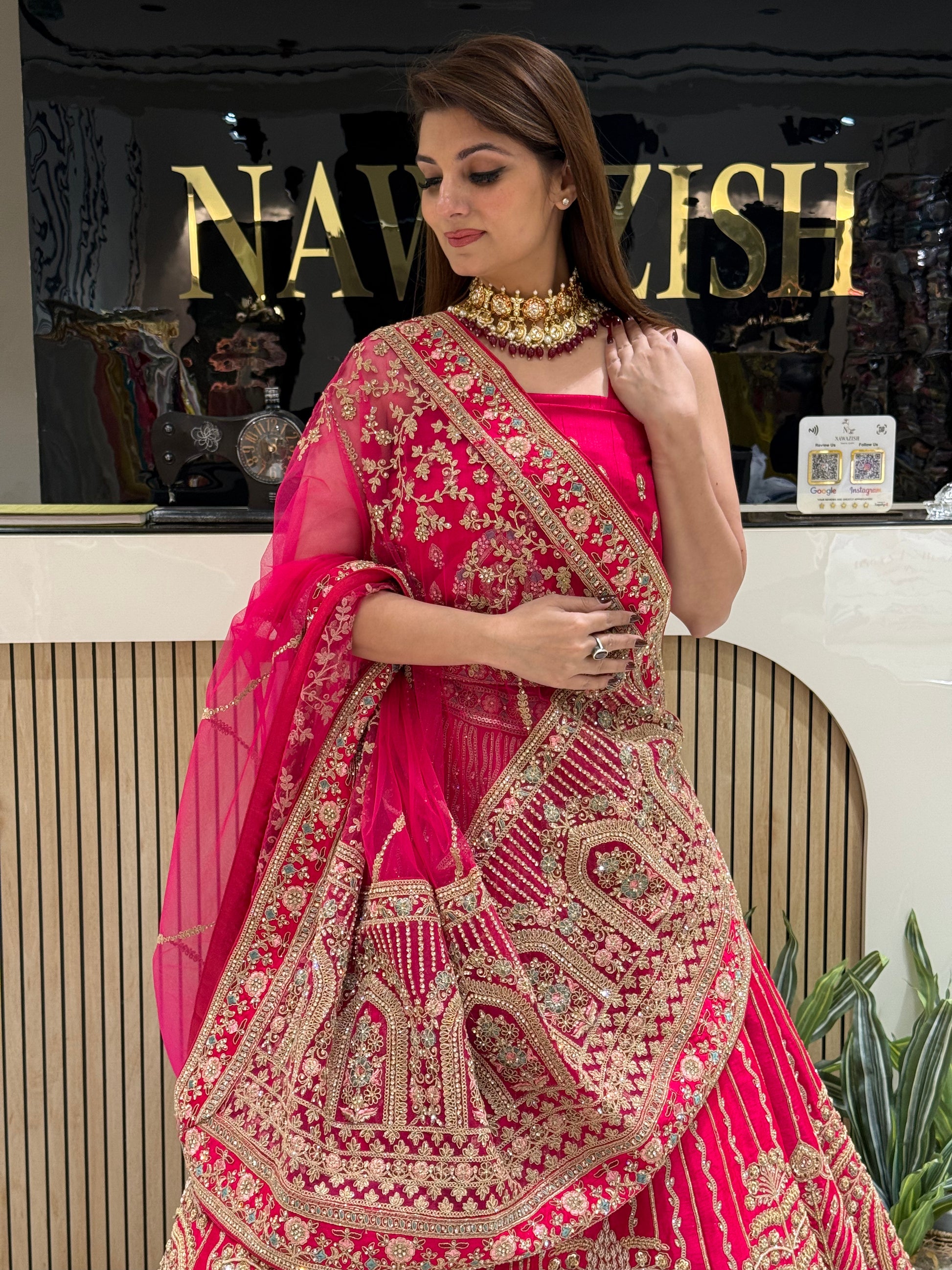 • Rani Pink bridal lehenga in Raw Silk with double net dupatta
• Designer bridal lehenga with machine work and heavy border dupatta
• Luxury wedding lehenga for brides with unstitched matching blouse
• Stylish bridal wear lehenga with two net dupattas and booti work
• Royal Raw Silk bridal lehenga perfect for wedding and reception wear