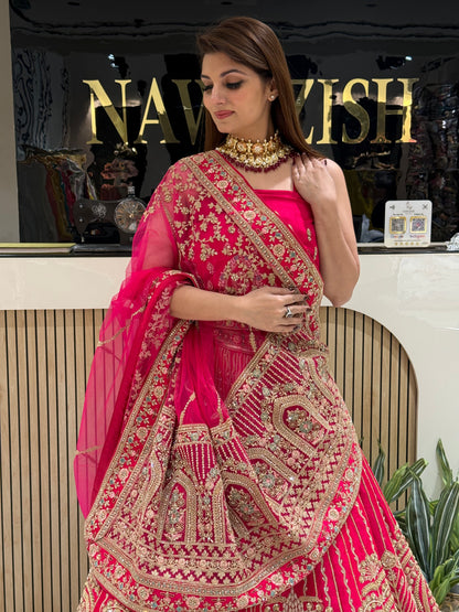 • Rani Pink bridal lehenga in Raw Silk with double net dupatta
• Designer bridal lehenga with machine work and heavy border dupatta
• Luxury wedding lehenga for brides with unstitched matching blouse
• Stylish bridal wear lehenga with two net dupattas and booti work
• Royal Raw Silk bridal lehenga perfect for wedding and reception wear