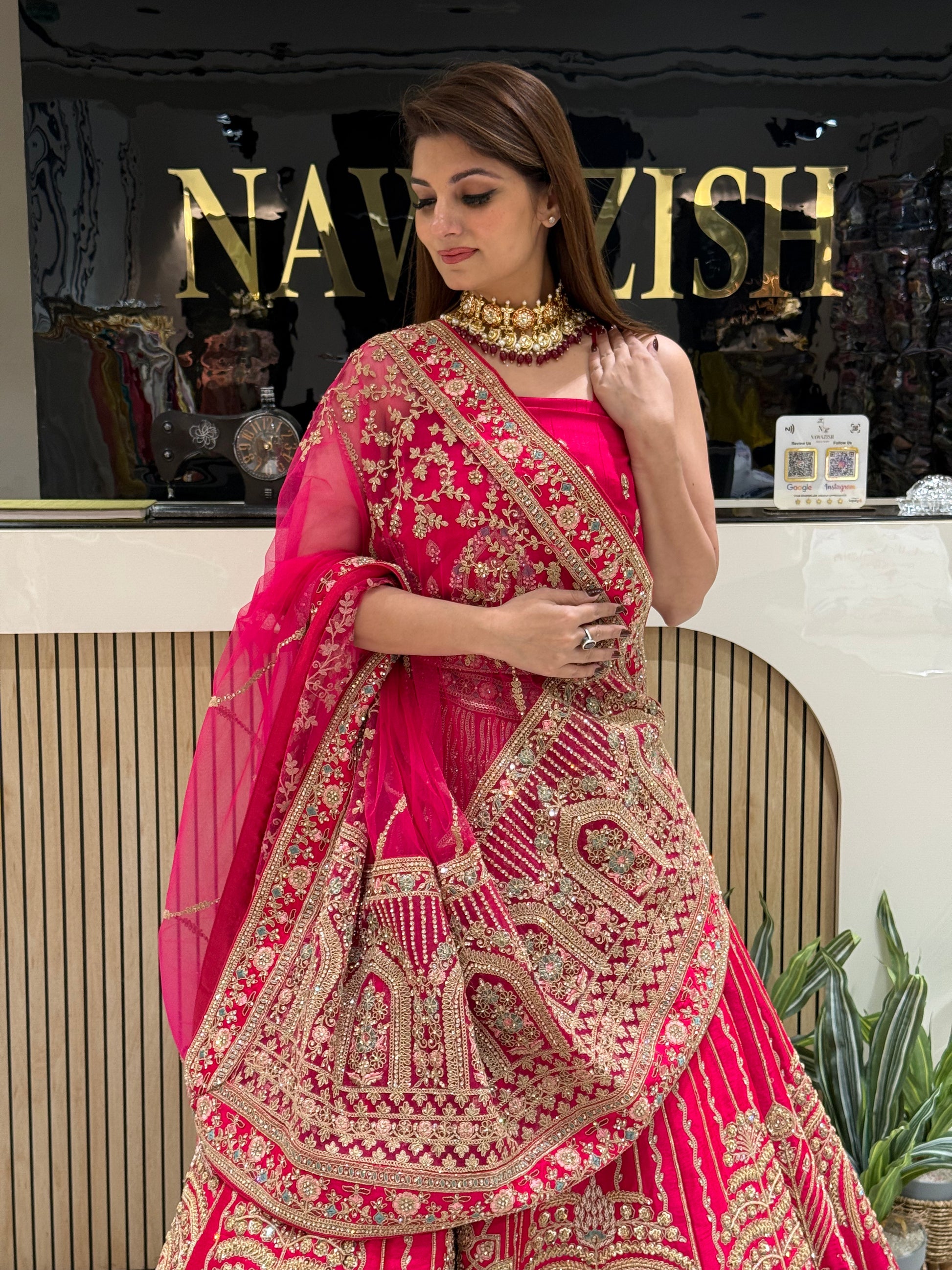 Rani Pink bridal lehenga in Raw Silk with double net dupatta
• Designer bridal lehenga with machine work and heavy border dupatta
• Luxury wedding lehenga for brides with unstitched matching blouse
• Stylish bridal wear lehenga with two net dupattas and booti work
• Royal Raw Silk bridal lehenga perfect for wedding and reception wear