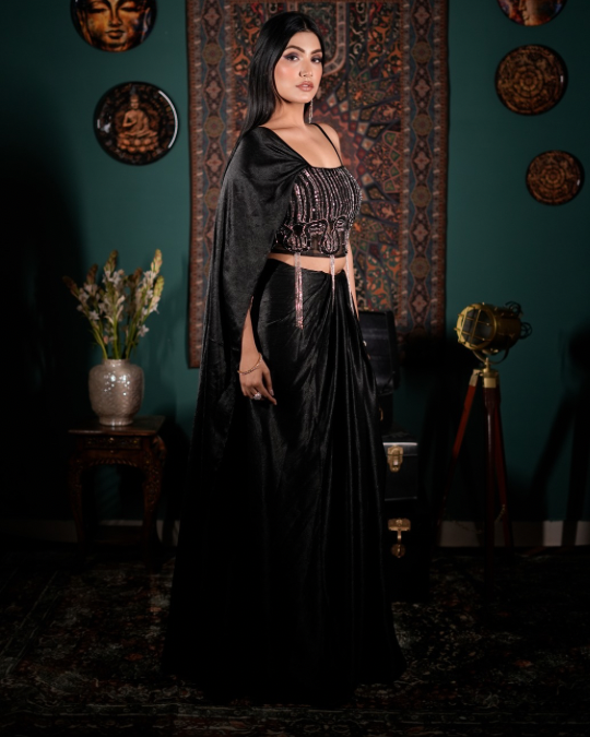 Trending Indo western dress 2026, Celebrity inspired fusion wear, Attached dupatta blouse, Statement black outfit, Luxury festive fashion