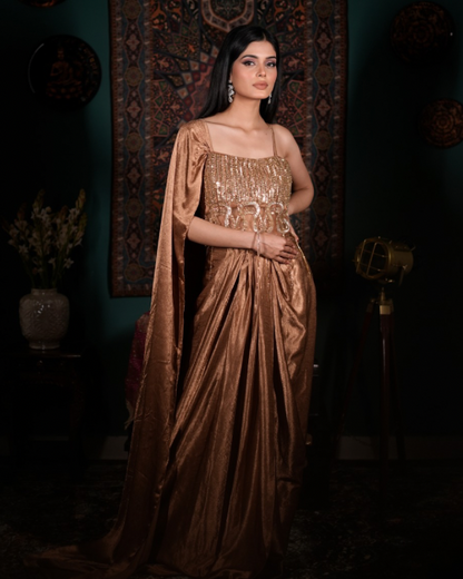 [Elegant gold couture outfit, Handcrafted crystal detailing, Chic Indo western ensemble, Modern ethnic glamour, Designer drape skirt look]