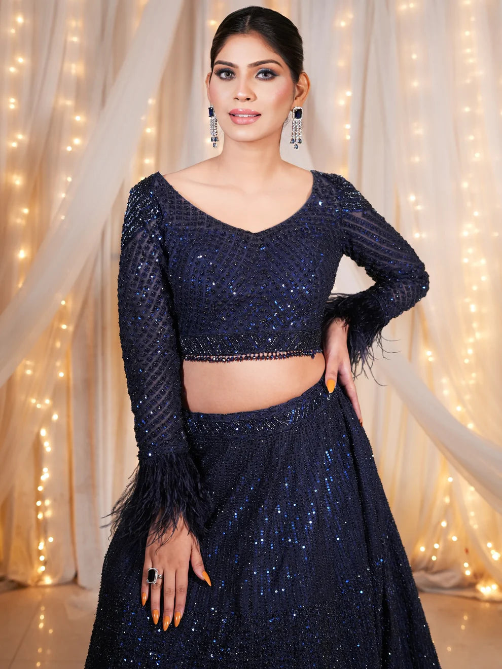 Turn heads at your sangeet or cocktail with Nawazish’s dazzling collection of sequinned lehengas. Designed for the modern Indian woman who loves glamour and sparkle, each piece is a celebration of bold style and fine craftsmanship. Shop the ultimate party-perfect lehengas with the right amount of bling and a whole lot of attitude.