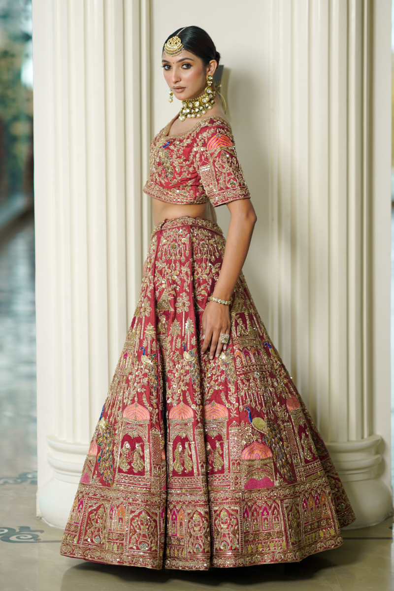 Immerse yourself in the beauty of heritage with Nawazish’s Temple Art rust-colored creation. Showcasing the most intricate hand embroidery inspired by temple architecture, this masterpiece reflects timeless Indian artistry and luxury craftsmanship. A regal statement piece perfect for weddings, cultural celebrations, or traditional events—where elegance meets heritage.